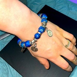 Azul and Gold swirled glass & silver Charmed coin stretch bracelet. Handmaid